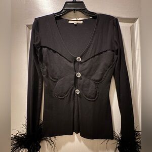 Manuri feather sleeve cuff top